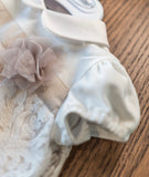 Pagliaccetto con applicazioni beige